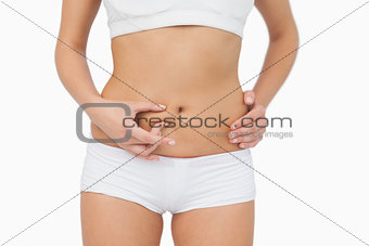 Slim young woman without any fat on her belly