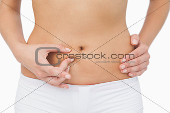 Young woman without any fat on her belly