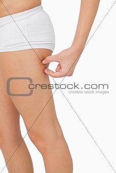 Young woman without any fat on her thigh