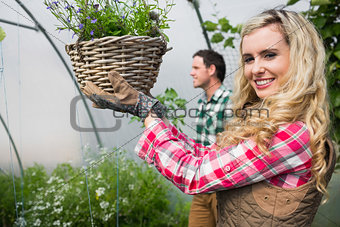 Blonde woman holding a flower basket