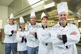 Team of chefs smiling at the camera