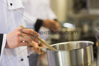 Chefs working at a stove