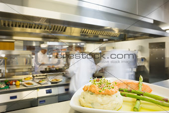 A plate with salmon asparagus and mashed potato