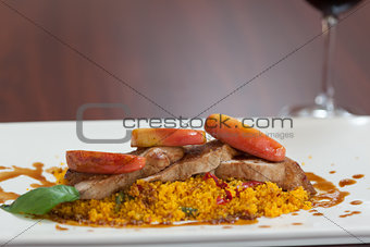 Front view of couscous dish with meat