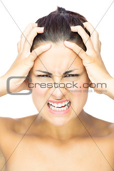 Front view of outraged brunette woman looking at camera