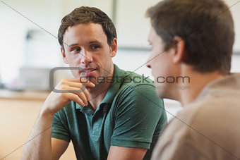 Two handsome mature students having a conversation