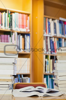 Piles of books on desk