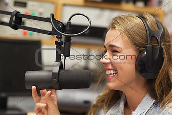 Laughing pretty radio host moderating