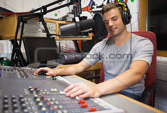 Handsome happy radio host moderating
