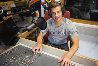 Handsome cheerful radio host moderating