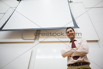 Elegant teacher with projection screen in the lecture hall