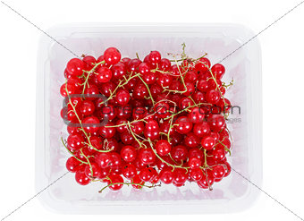 pile berries of red currant on white background