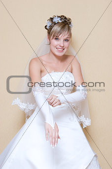 bride puts on a glove