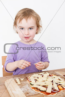cute girl making fresh pizza