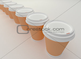 A row of paper coffee cups.