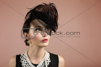 Woman Portrait in Retro Black Hat with a Veil