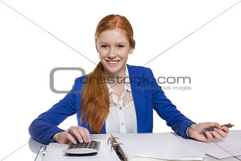 Young businesswoman is  calculating and writing on a paper