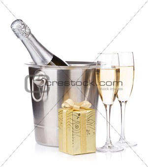 Champagne bottle in bucket, glasses and gift box