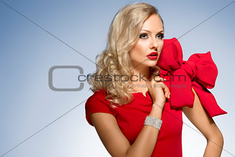 cute blond young girl in red with big bow