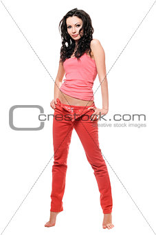 Sexy young brunette in a red jeans