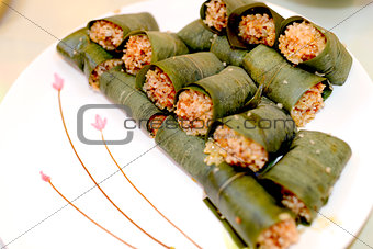 Sticky rice steamed in bamboo leaves