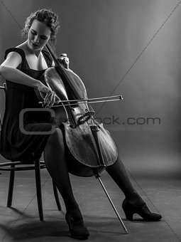 Woman playing the cello black and white