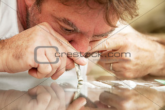 Man Snorting Cocaine