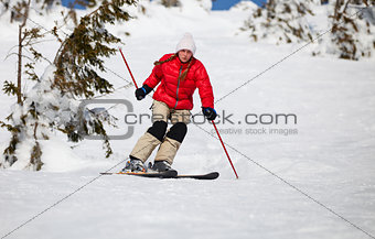 Young woman skiing in mountains