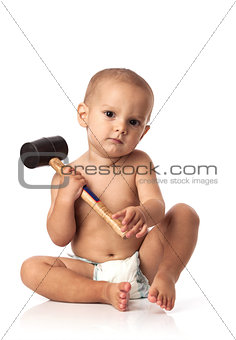 Cute little boy with a hammer over white background