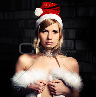 Young woman wearing a Santa Claus hat