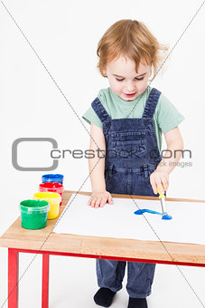 young girl working with paint