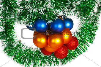 Christmas balls on a green tinsel as a symbol of the New year