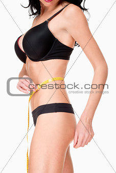 Woman in Black Underwear Measuring Results of Diet 