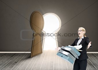 Businesswoman dropping many folders