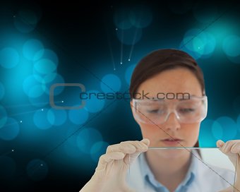 Young doctor holding clear pane