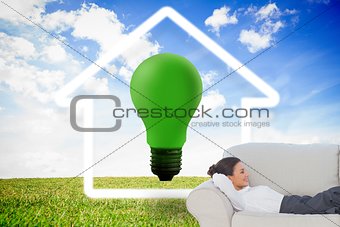 Smiling businesswoman lying down on the couch