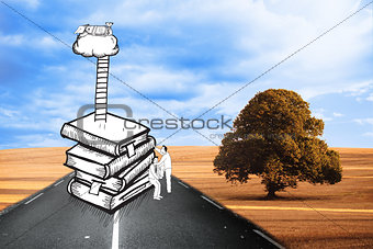 Two men climbing books over landscape