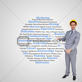 Composite image of architect with hard hat holding plans