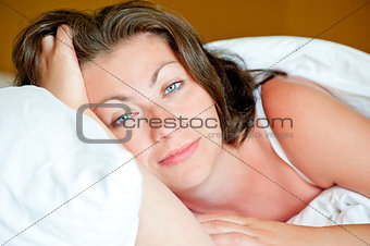  Portrait of a beautiful girl has woken up in bed