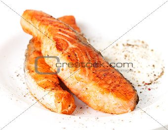 Fried salmon fillets with sauce