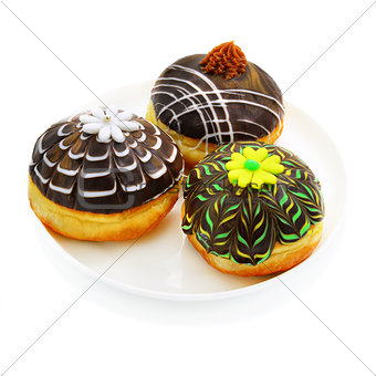 Three donuts with chocolate