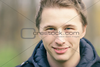 close up portrait of handsome yound man outdoors