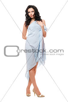 Beautiful young brunette wrapped in blue cloth