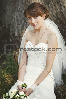 Beautiful  caucasian bride posing in garden.