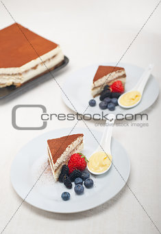 tiramisu dessert with berries and cream