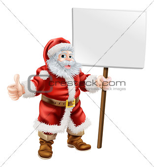 Santa holding sign and doing thumbs up