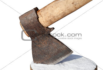 Axe and log with snow. Close-up view.