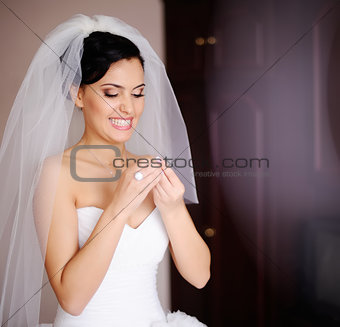 young  bride is getting ready