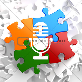 Microphone Icon on Multicolor Puzzle.