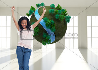Composite image of a young happy woman stands with her hands in the air